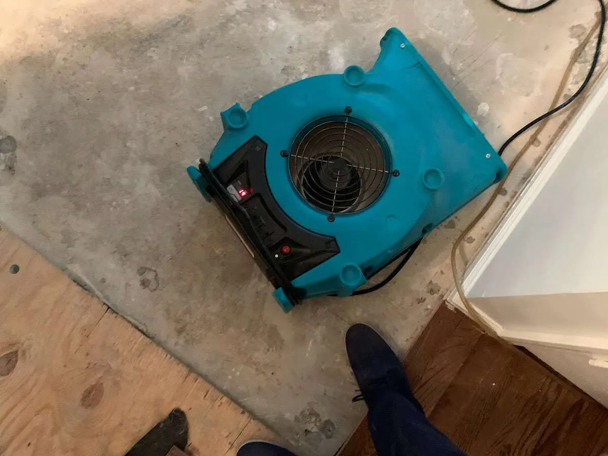 Air mover drying subfloor during Leak Detection & Repair in Stillwater
